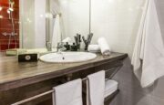 Bathroom with sink and shower cabin in chalet Snow Pearl