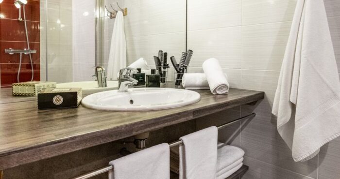 Bathroom with sink and shower cabin in chalet Snow Pearl